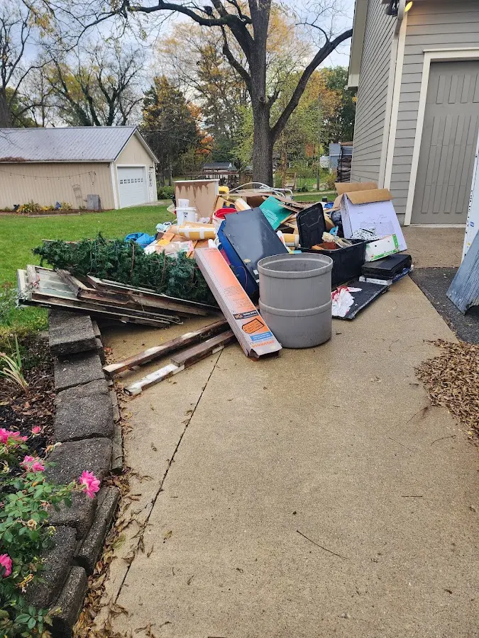 Dumpster being loaded with debris for 3 Yard Dumpster Rental in West Brookfield